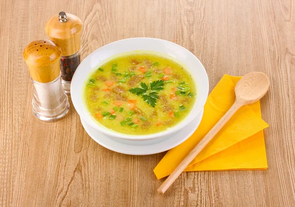 Tasty soup on wooden background — Stock Photo, Image