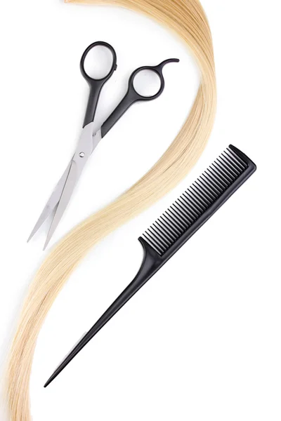Shiny blond hair with hair cutting shears and comb isolated on white — Stock Photo, Image