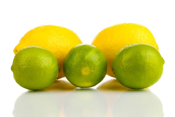 Fresh limes and lemons isolated on white — Stock Photo, Image