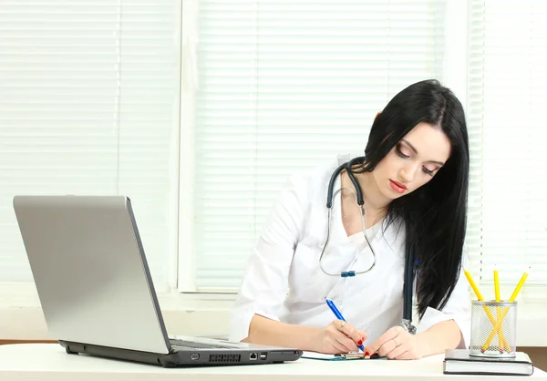 Beautiful girl doctor in the office — Stock Photo, Image