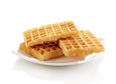 Sweet waffles on plate isolated on white clipart