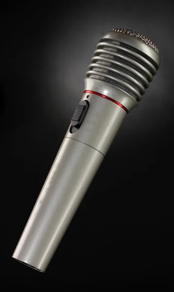 Shiny grey iron microphone on black background — Stock Photo, Image