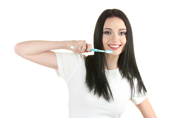 Hermosa joven sosteniendo cepillo de dientes aislado en blanco — Foto de Stock