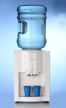 Electric water cooler on blue background clipart