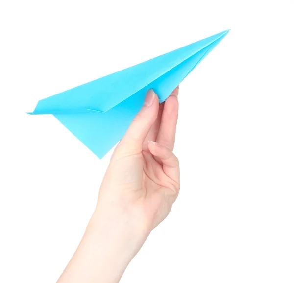 白で隔離される手で折り紙の紙飛行機 — ストック写真