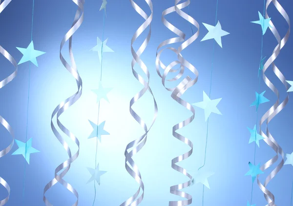 Piękne serpentyny i gwiazd na niebieskim tle — Zdjęcie stockowe
