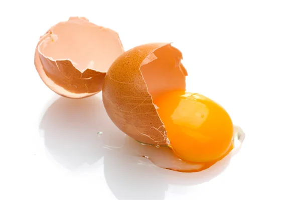 Brown egg with yolk isolated on white — Stock Photo, Image