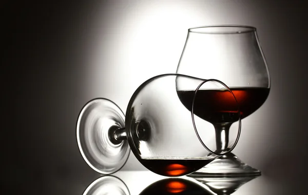 Stock image Two glasses of cognac on grey background