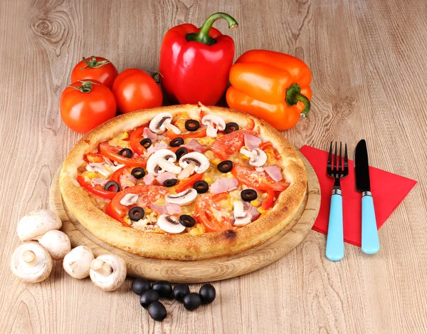 Aromatic pizza with vegetables and mushrooms on wooden background — Stock Photo, Image