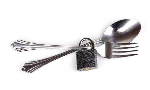 stock image Fork and spoon with padlock isolated on white