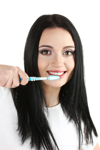 Hermosa joven sosteniendo cepillo de dientes aislado en blanco — Foto de Stock