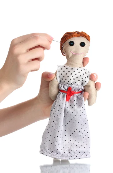 Voodoo docka flicka i händerna på kvinnor isolerade på vit — Stockfoto