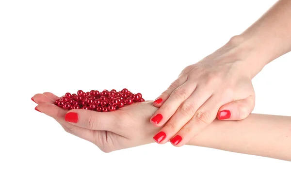 Kobiece ręce z manicure i czerwone korale na białym tle — Zdjęcie stockowe