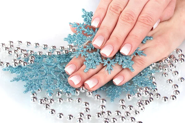 Piękne dłonie i płatki śniegu i koraliki na białym tle — Zdjęcie stockowe