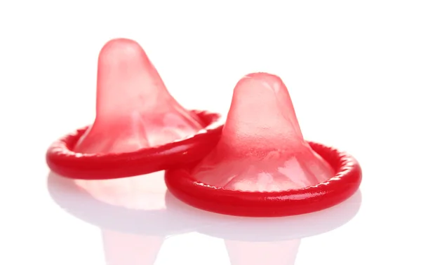 Red condoms isolated on white — Stock Photo, Image