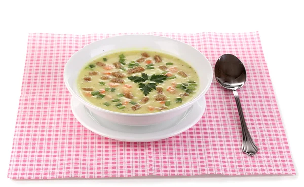 Tasty soup on pink napkin isolated on white — Stock Photo, Image