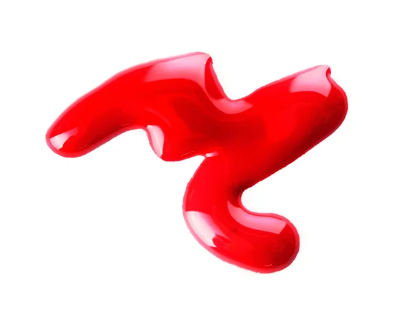 Красные капли лака для ногтей изолированы на белом — стоковое фото
