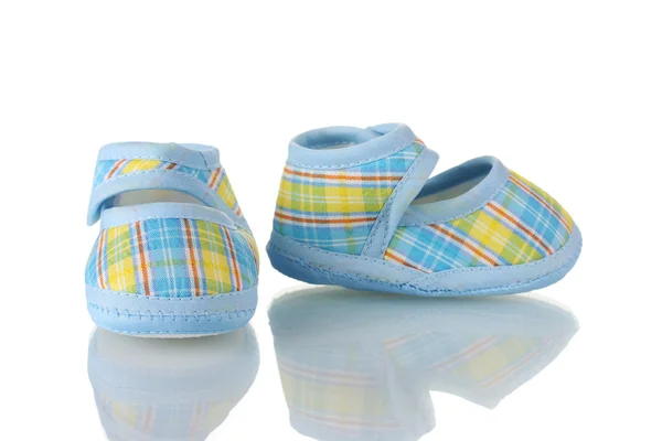 Blue baby shoes isolated on white Stock Photo