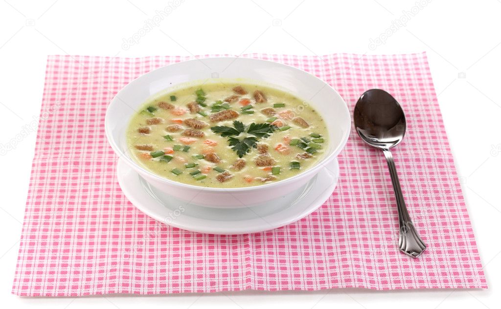Tasty soup on pink napkin isolated on white