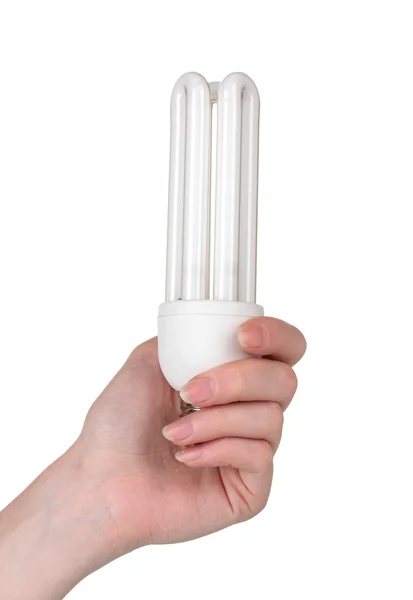 Arm hält Energiesparlampe isoliert auf weiß — Stockfoto