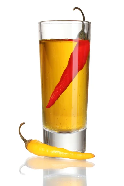 Glass of pepper vodka and red chili peppers isolated on white — Stock Photo, Image
