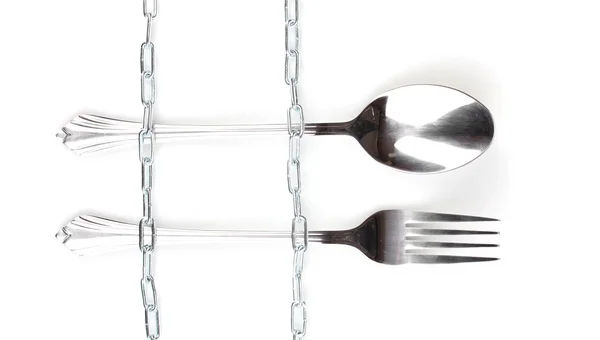 stock image Fork and spoon with chain isolated on white