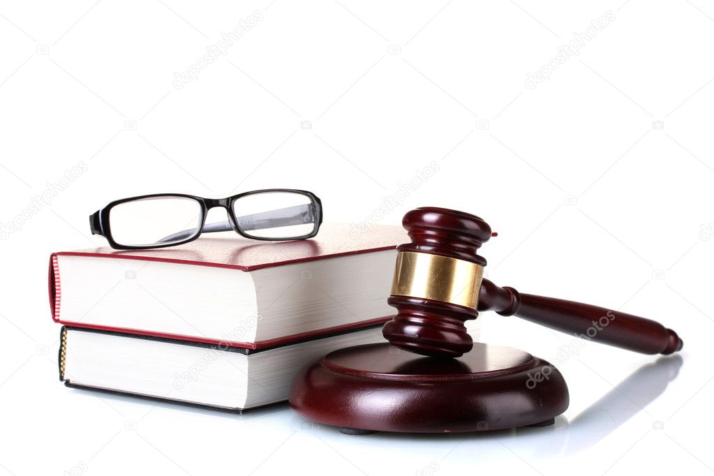 Wooden gavel, glasses and books isolated on white