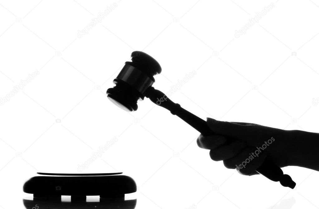 Wooden gavel in hand isolated on white
