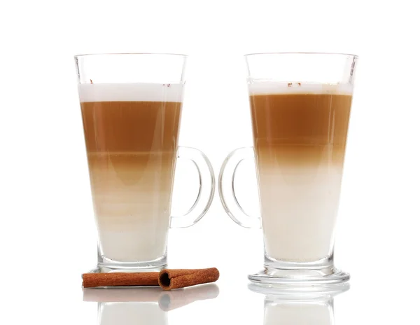 stock image Fragrant сoffee latte in glass cups and cinnamon isolated on white