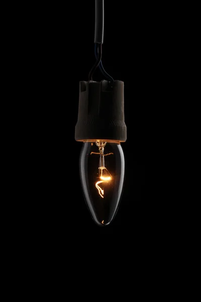 Siyah arka plan aydınlatılmış bir ışık — Stok fotoğraf