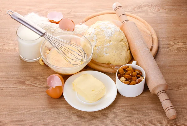 Ingredients for the dough wooden table — Stock Photo, Image