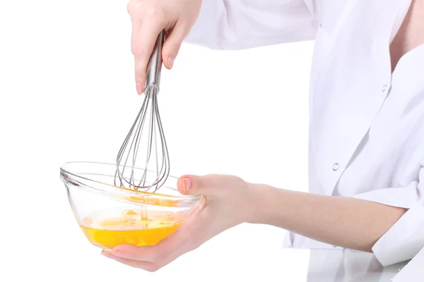 stock image Female hands Mixing eggs in bowl isolated on white