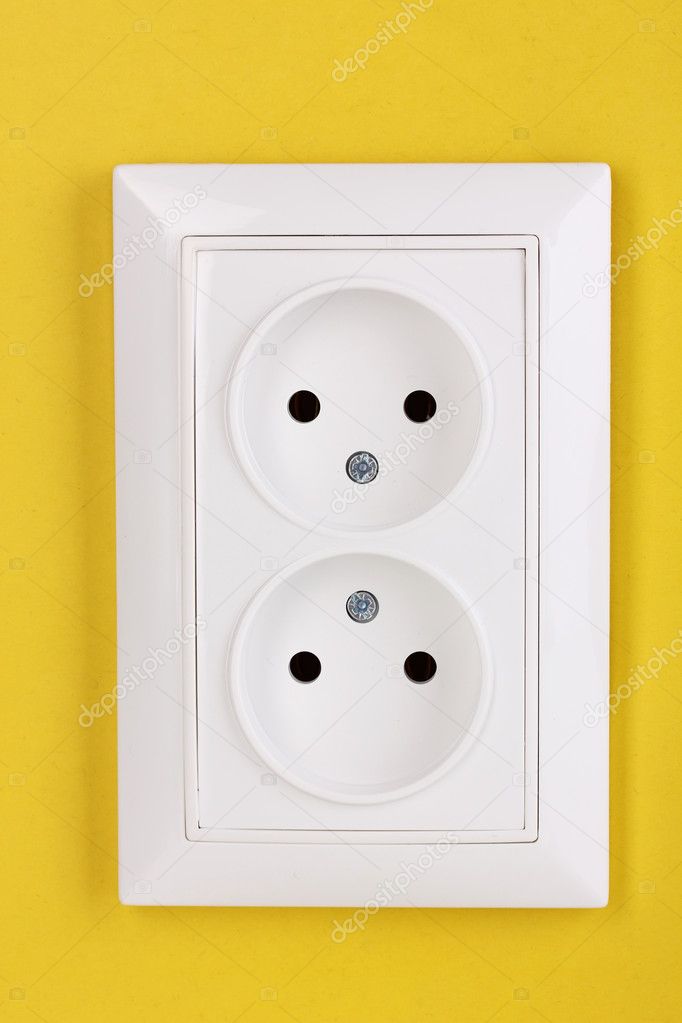 White electric socket on the wall
