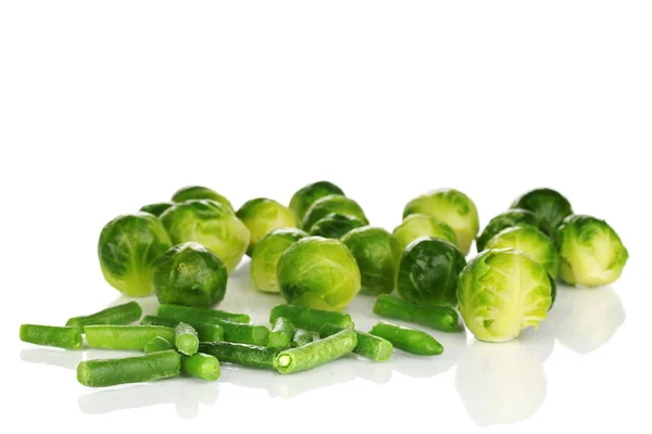 Fresh brussels sprouts and french bean isolated on white — Stock Photo, Image