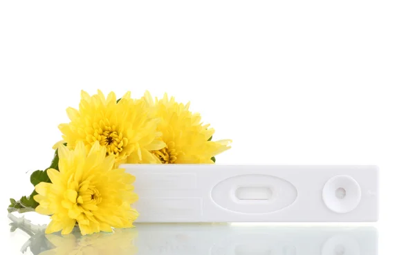 stock image Pregnancy test and flowers isolated on white