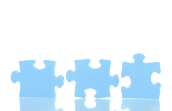 Blue puzzles closeup, isolated on white — Stock Photo, Image