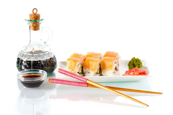 Tasty rolls served on white plate with chopsticks and soy sauce isolated on — Stock Photo, Image