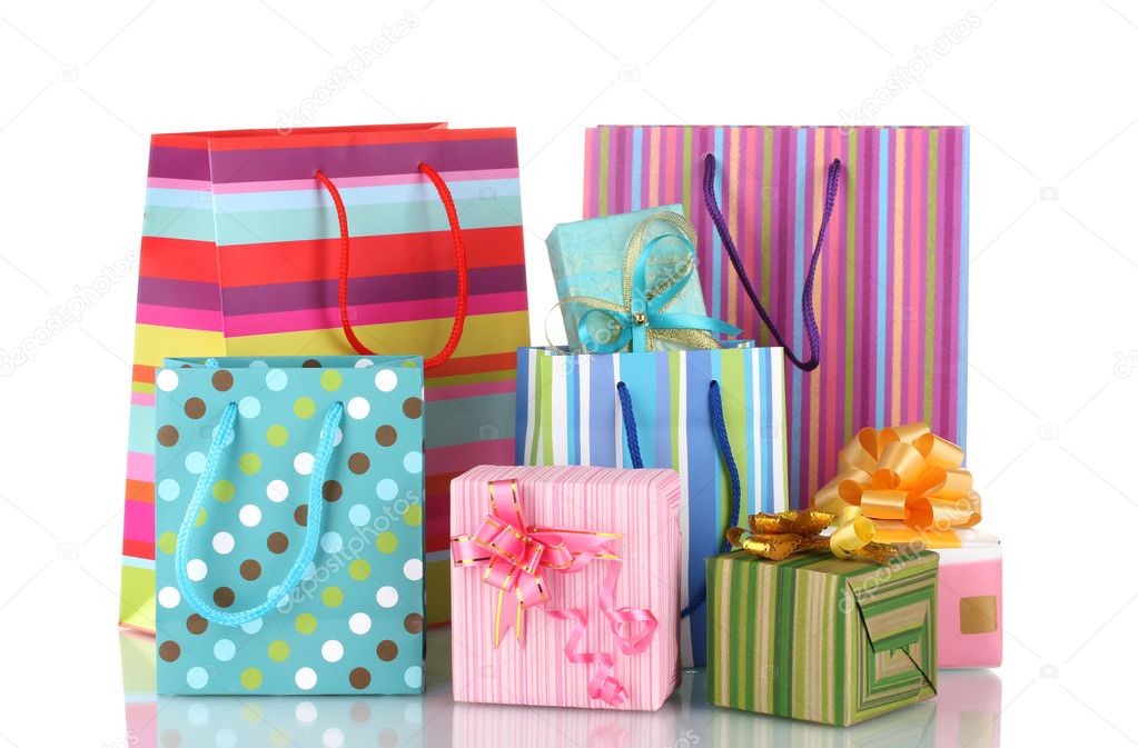 Bright gift bags and gifts isolated on white