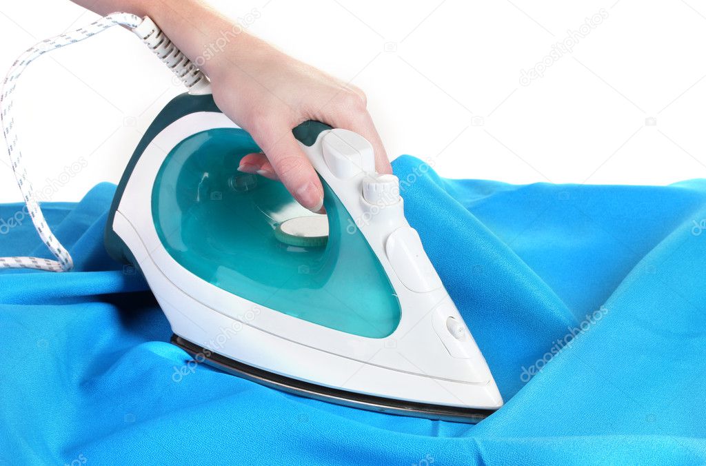 Electric iron on blue cloth isolated on white