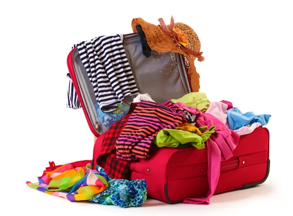 Open red suitcase with clothing isolated on a white — Stock Photo, Image