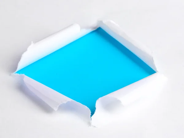 Carta strappata con sfondo blu — Foto Stock