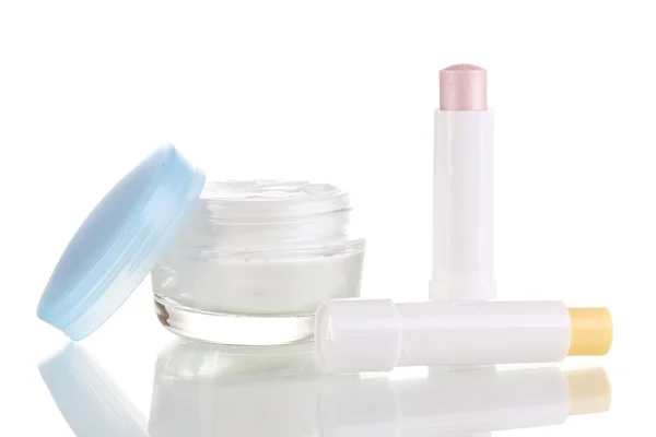 Hygienic lipsticks and moisturizing cream isolated on white — Stock Photo, Image