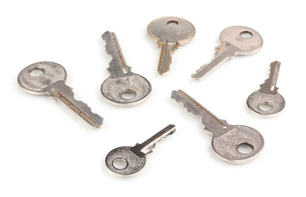 Many metal keys isolated on white — Stock Photo, Image