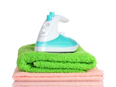 Two towels and iron isolated on white clipart