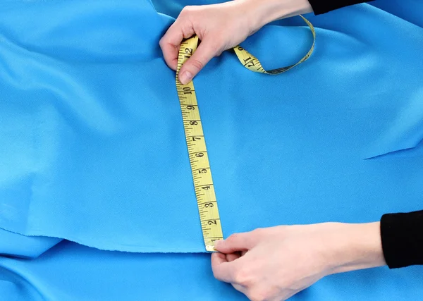 Mulher tecido de medição — Fotografia de Stock