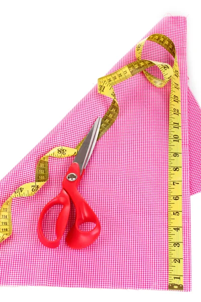 Scissors, measuring tape and pattern on fabric isolated on white — Stock Photo, Image