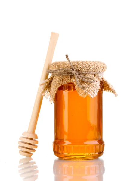 Sladký medu ve sklenici s drizzler izolované na bílém — Stock fotografie