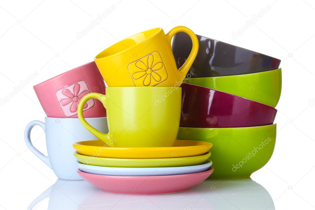 Bright empty bowls, cups and plates isolated on white