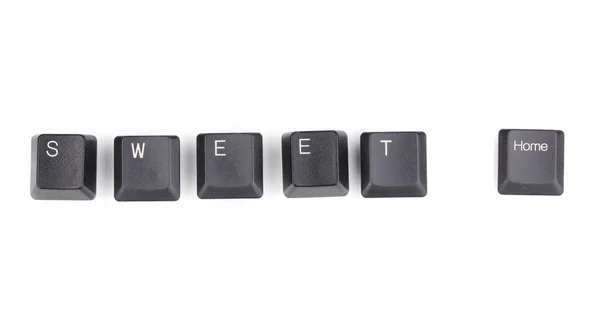 Keyboard keys saying sweet home isolated on white — Stock Photo, Image