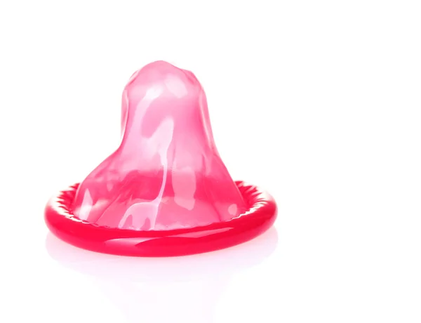 Červená kondom izolovaných na bílém — Stock fotografie